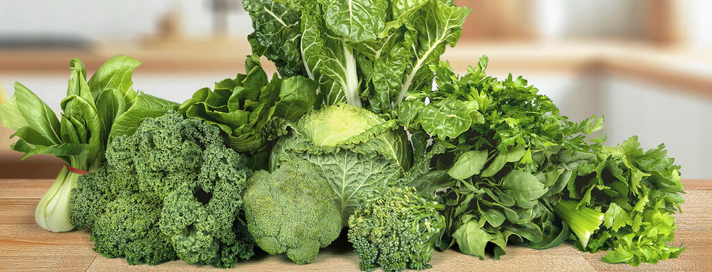 Photo of green vegetables on a table